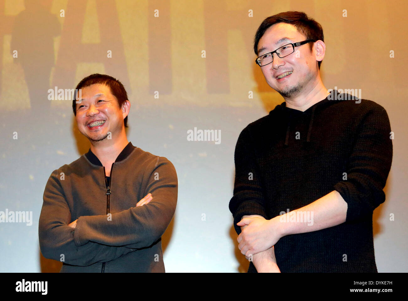 Beijing, China. 21st Apr, 2014. Photographer Cao Yu(L) and director Lu Chuan(R) attend the 10th anniversary activity of film 'Mountain Patrol' in Beijing, capital of China, April 20, 2014. Film 'Mountain Patrol', directed by Lu Chuan, was screened in China on Oct. 1, 2004. © Xinhua/Alamy Live News Stock Photo