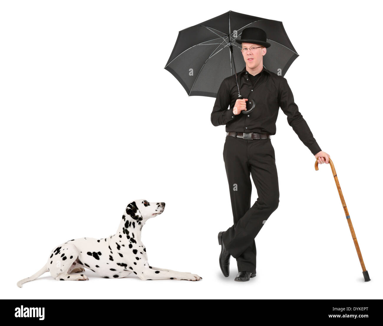 young man with bowler hat, umbrella and walking stick Stock Photo
