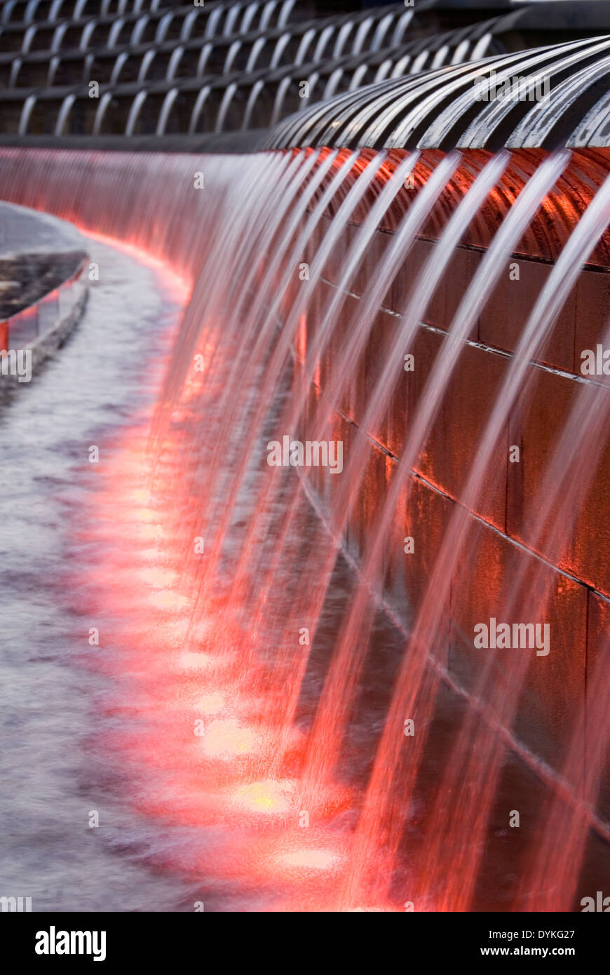 Sheaf Square, Sheffield, UK 02 Mar 2013: water pouring from Cascades water feature fountain lit up with red lights at night Stock Photo