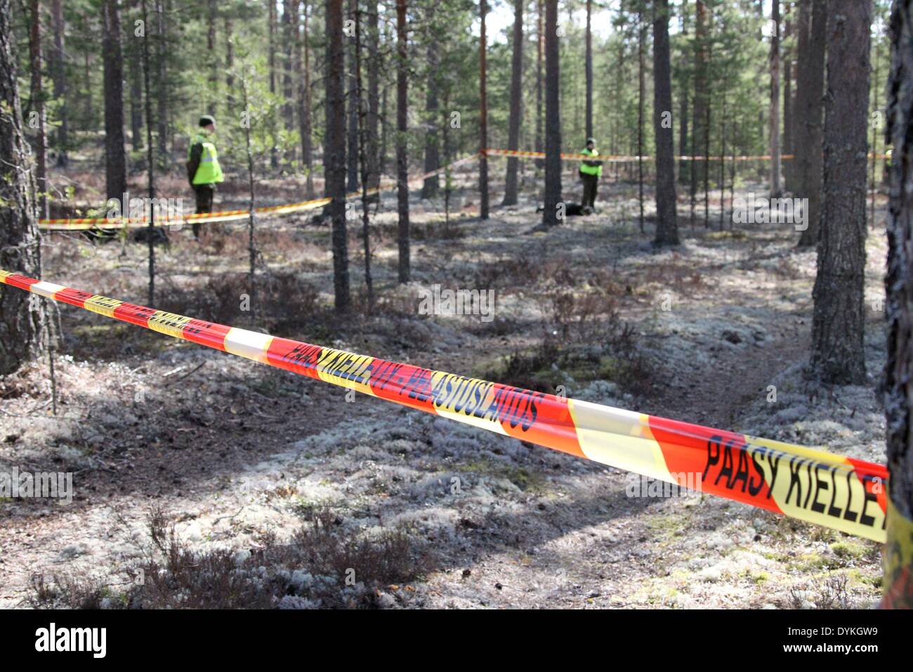 Jamijarvi. 21st Apr, 2014. Soldiers guard the crash site of a plane near the Jamijarvi airport in southern Finland, April 21, 2014. A small passenger plane carrying 10 parachuters crashed on Sunday in the Satakunta region, Southwest Finland, causing eight dead. The pilot and two parachuters survived by ejecting from the aircraft before it crashed, and eight others were found dead around the wreckage. Credit:  Li Jizhi/Xinhua/Alamy Live News Stock Photo