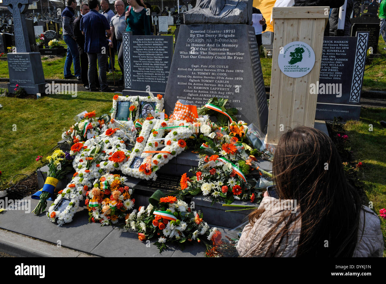 Derry, Londonderry, Northern Ireland. 21st April, 2014. Dissident Republicans Commemorate Easter Rising. A young girl taking photographs of wreaths laid at the republican plot during the Irish republican 32 County Sovereignty Movement parade in the City Cemetery in Derry. Credit: George Sweeney/Alamy Live News Stock Photo