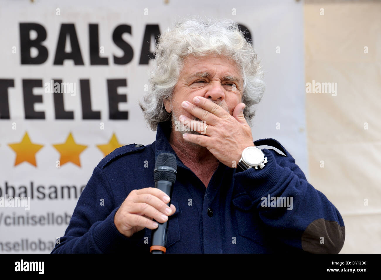 Beppe Grillo during a political meeting in a square (five stars movement), close-up whit open left hand on the lips. Stock Photo