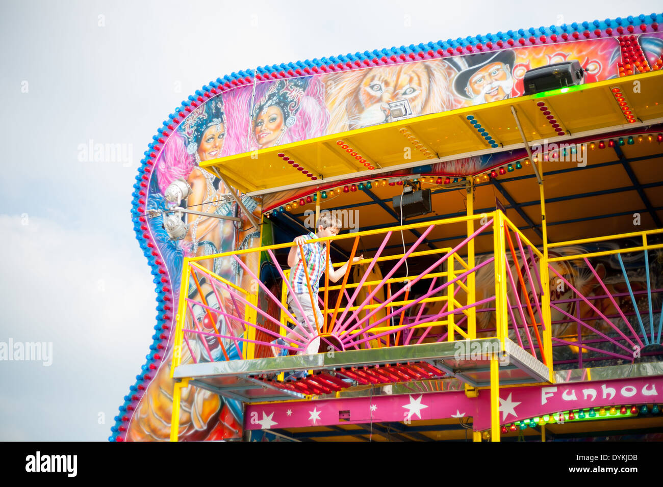 Child on colorful fair attraction having fun Stock Photo