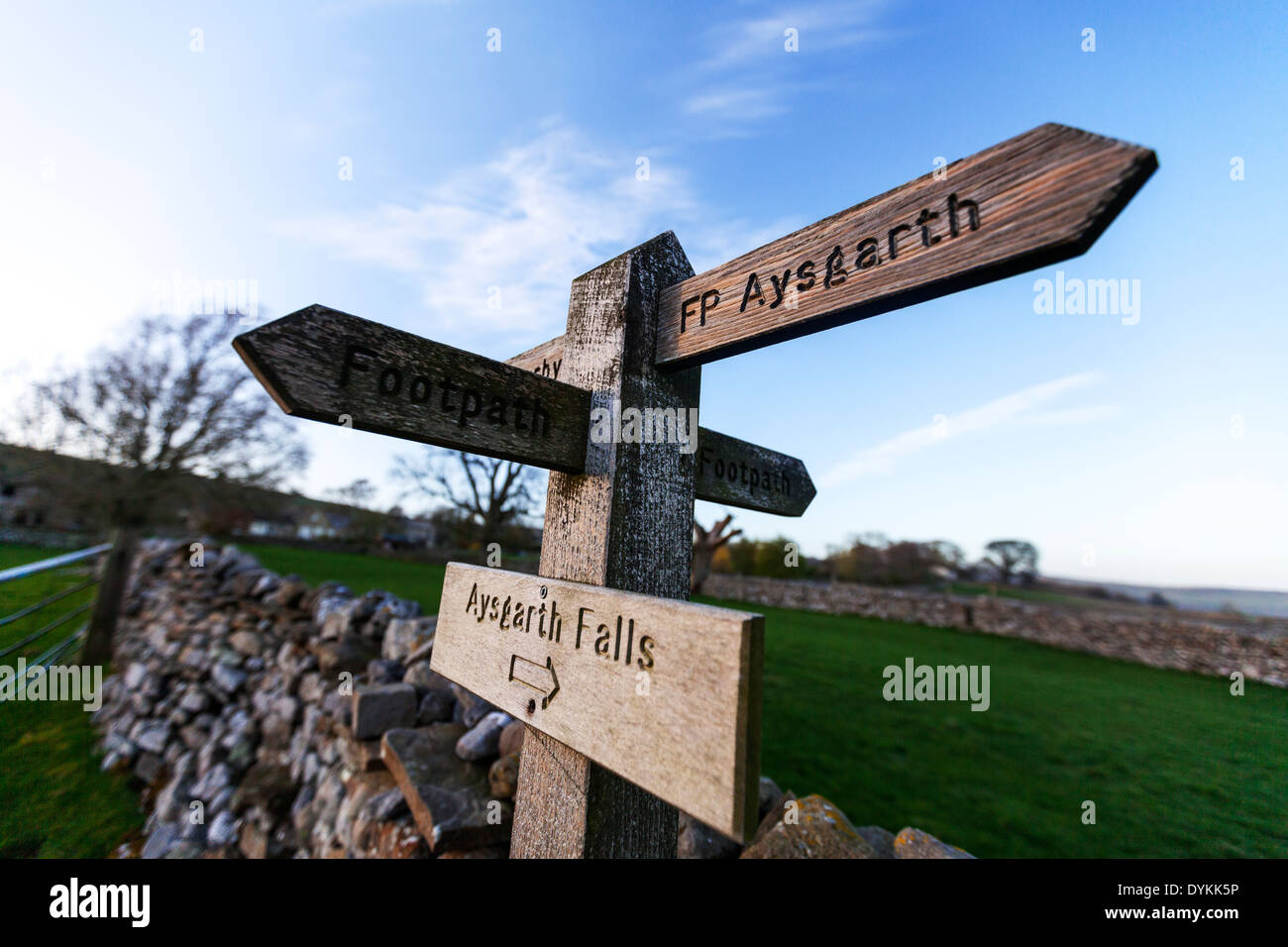 Directions sign post Aysgarth Carperby pointing way stone wall drystone