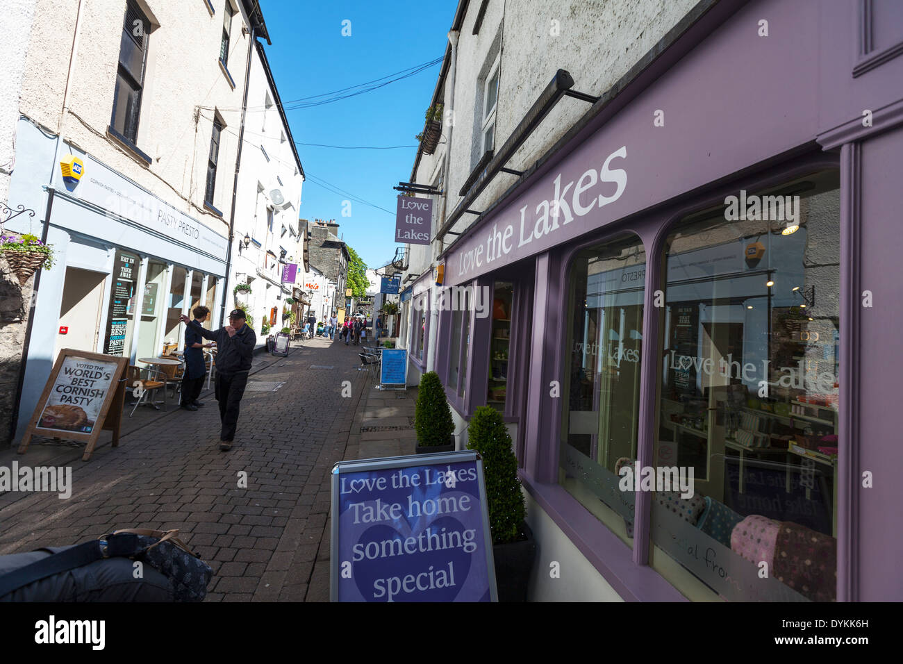 Windermere Town shops and shoppers tourists shopping Cumbria National Park, UK England GB Stock Photo