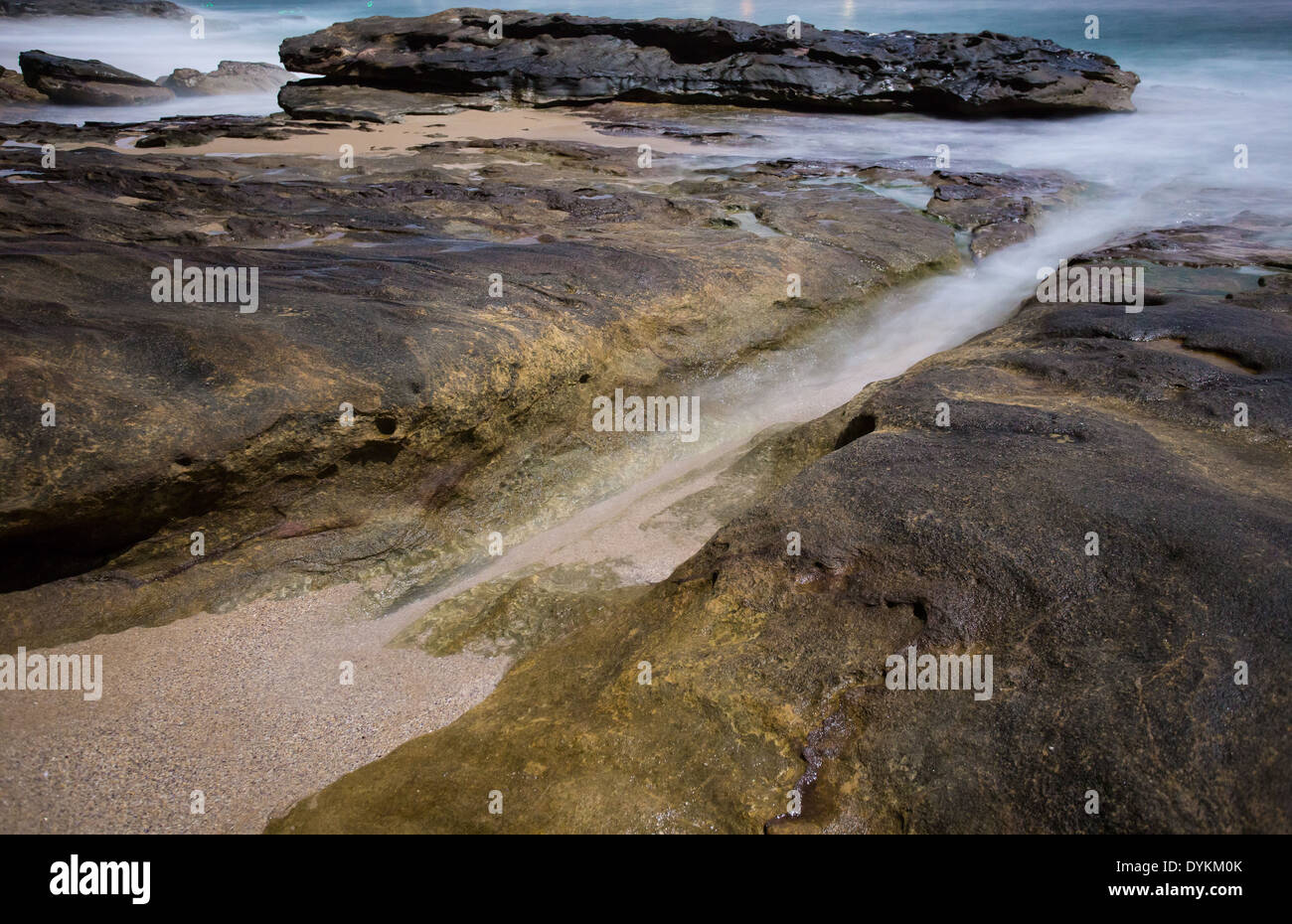 Jibbon Beach in moonlight, Bundeena, NSW Australia Stock Photo