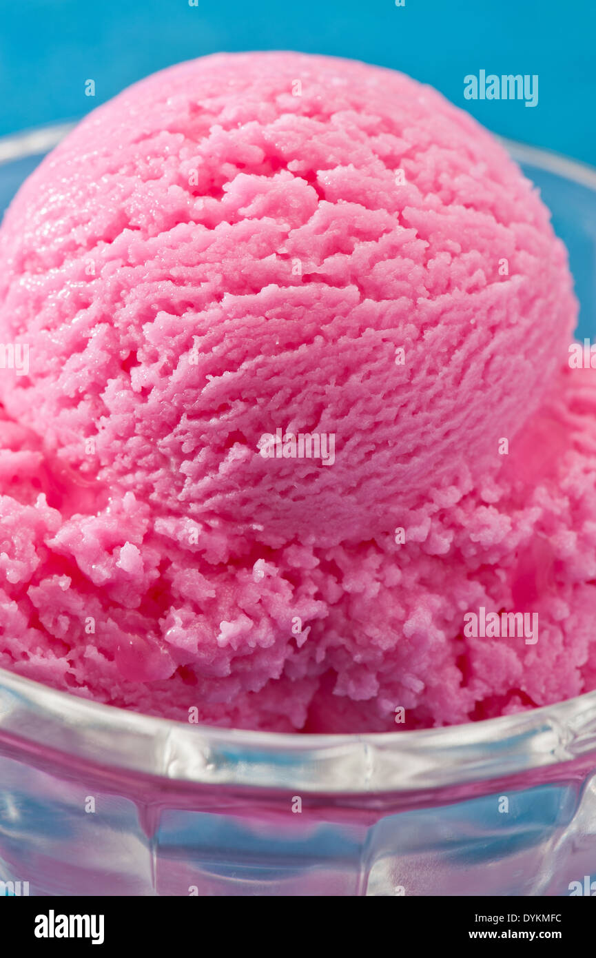 raspberry ice cream over a blue background Stock Photo - Alamy