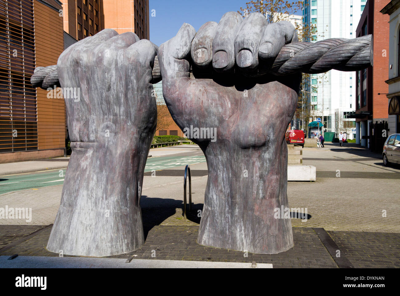 'All Hands' sculpture by Brian Fell, Depicting canal workers pulling on ropes, Custom House Street, Cardiff, Wales, UK. Stock Photo