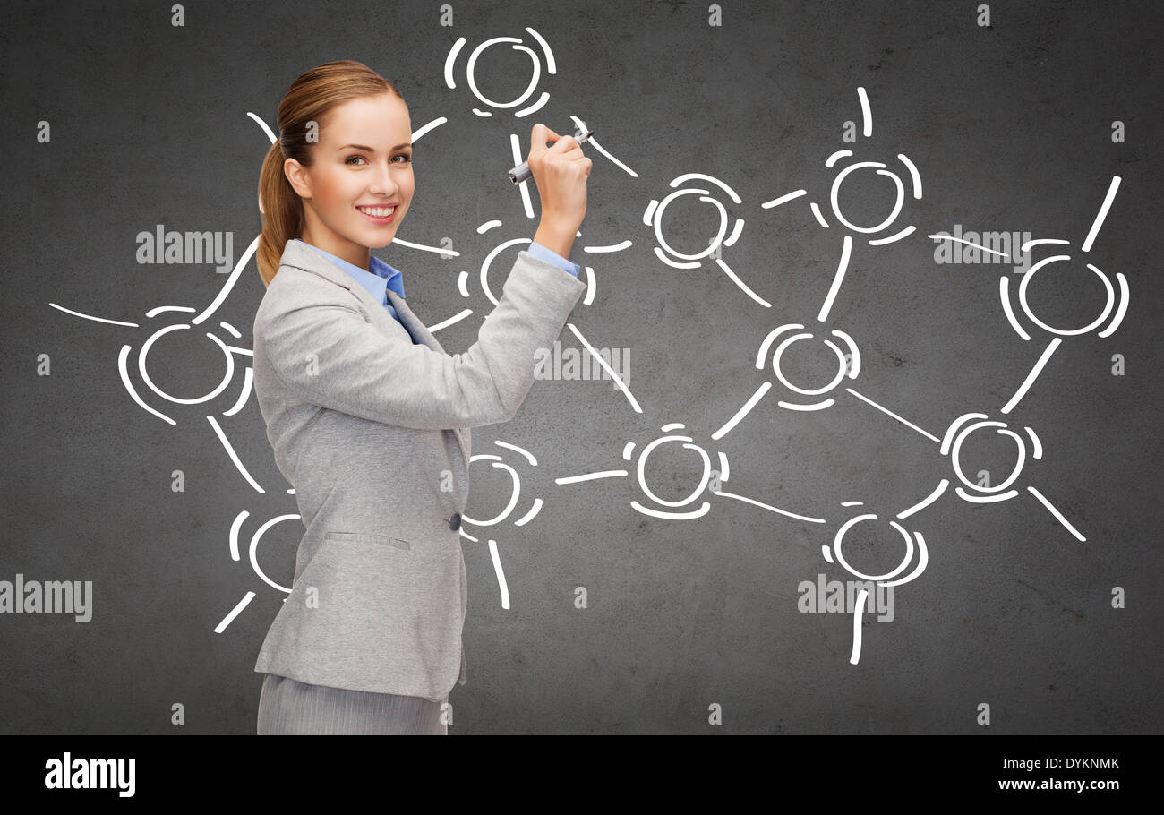 businesswoman writing something in air with marker Stock Photo