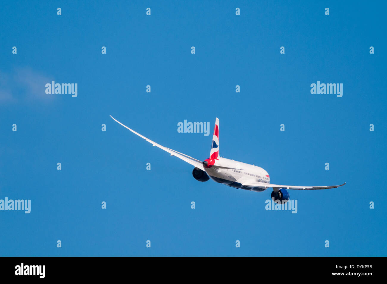 Rear view of a British Airways Boeing 787 Dreamliner plane banking away after taking off Stock Photo