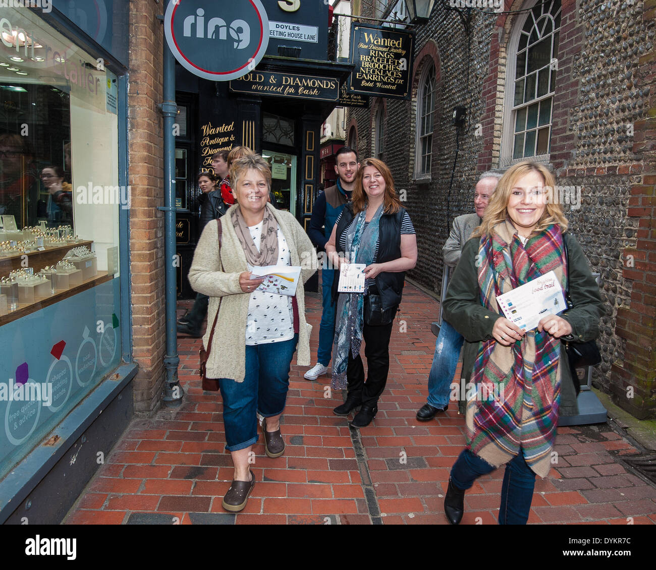 Brighton, UK. 21st April, 2014. Food Trail participants on the way to the next restaurant: Visitors on the Brighton & Hove Food and Drink Festival Food Trail in Brighton sample the delights of 10 local restaurants and bars whilst following the trail around The Lanes and North Laine of Brighton. Taking part were Aguadulce, Be At One, Boho Gelato, La Cave a Fromage, The Chilli Pickle, La Choza, Moshimo, Julien Plumart, The Manor, Yum Yum Ninja. photo Credit: Julia Claxton/Alamy Live News Stock Photo