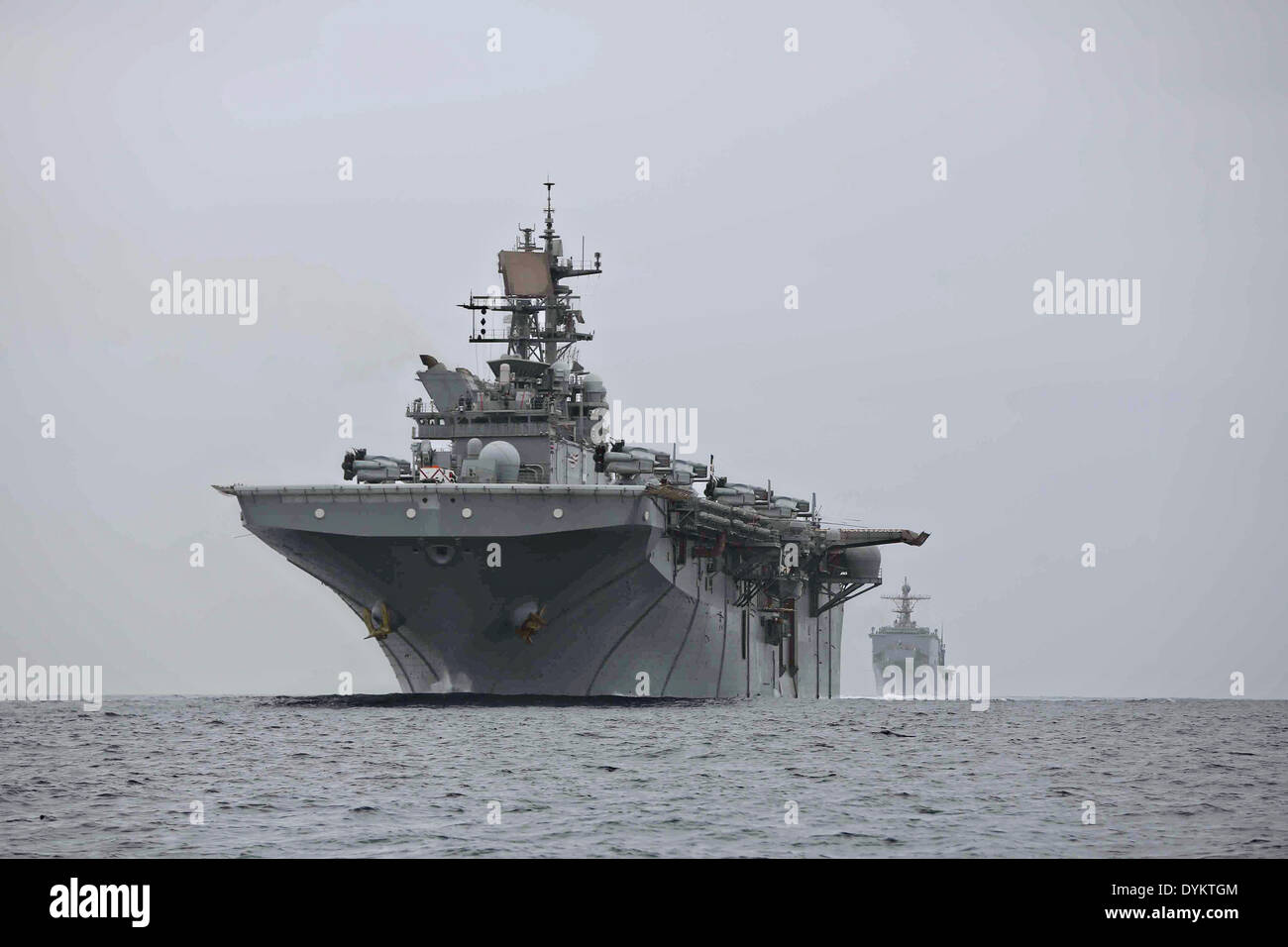 US Navy USS Makin Island and USS Comstock sail in formation during Amphibious Squadron Marine Expeditionary Unit Integration Training April 17, 2014 off the coast of San Diego, California. Stock Photo