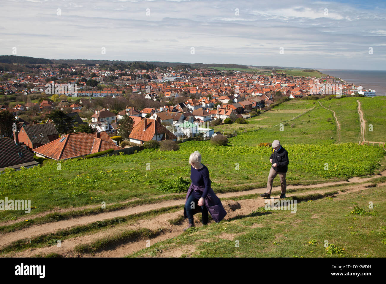Couple walking along one of Sheringham's clifftop footpaths Stock Photo