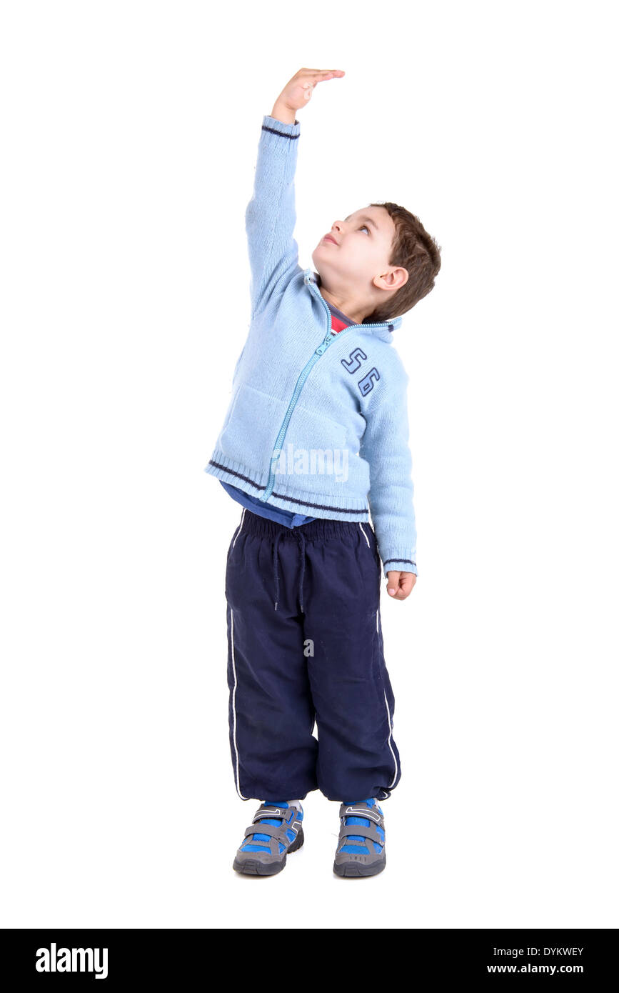 Young boy measuring his height isolated in white Stock Photo