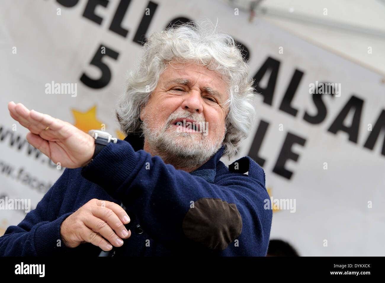 Beppe Grillo during a political meeting in a square (five stars movement), with flat left hand. Stock Photo