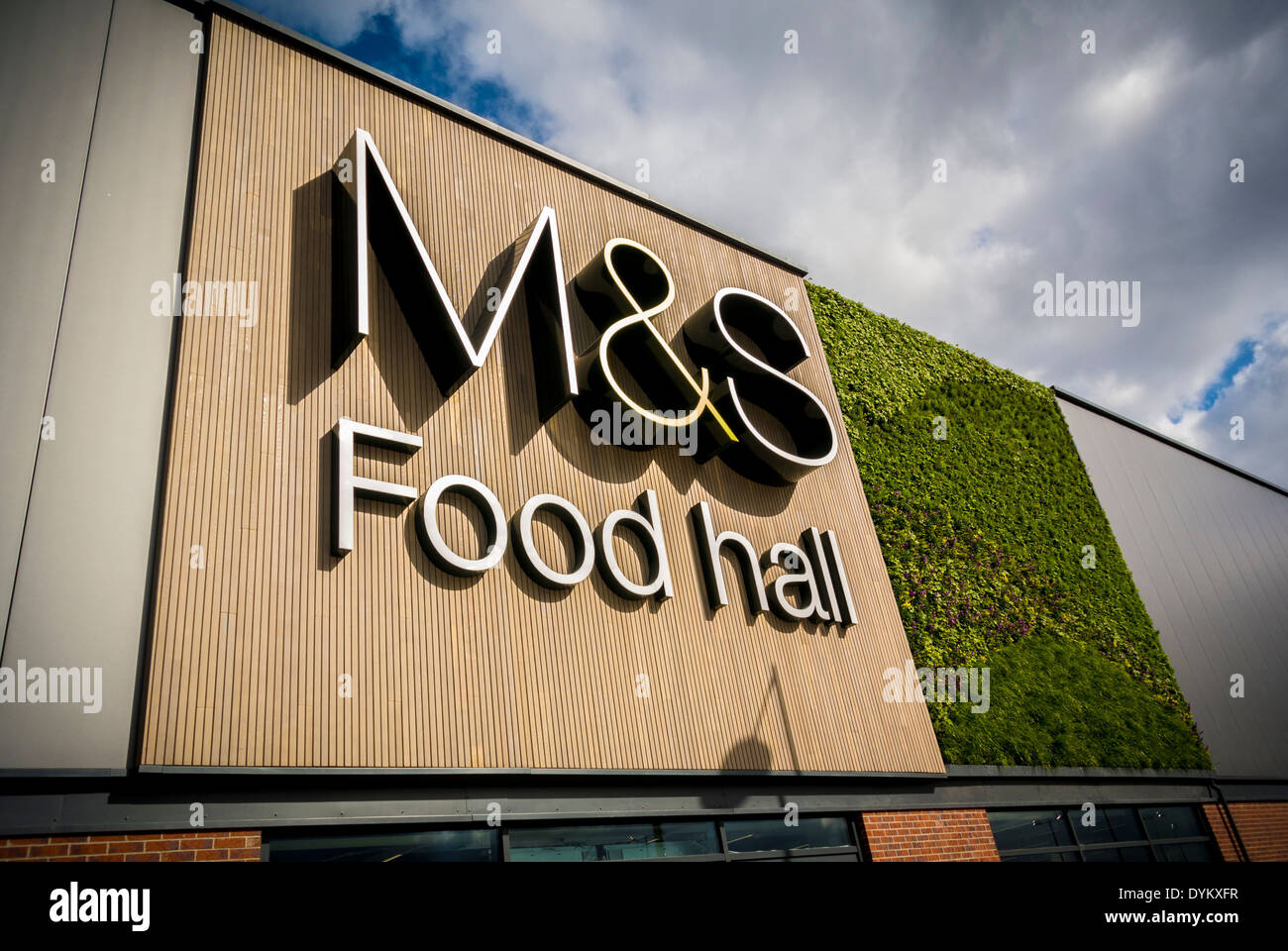 Marks And Spencer Food Hall sign with Green Living Wall Stock Photo