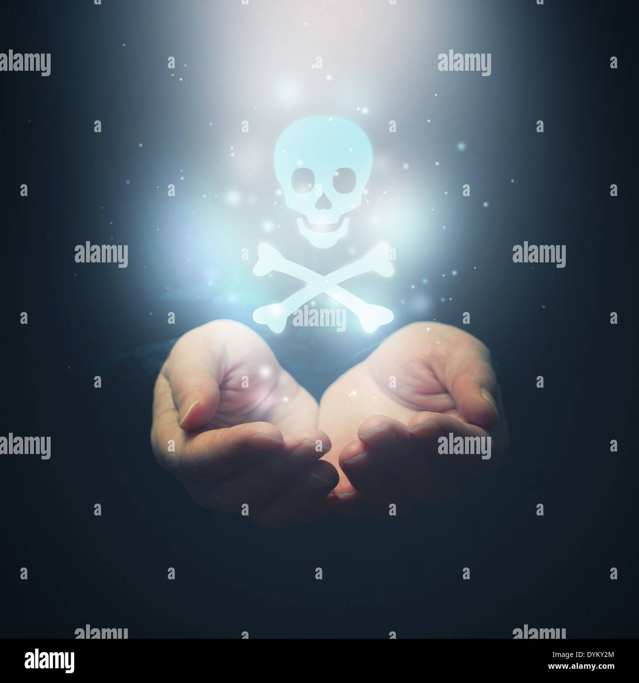 Female hands opening to light and skull as symbol of poison or something deadly and dangerous Stock Photo