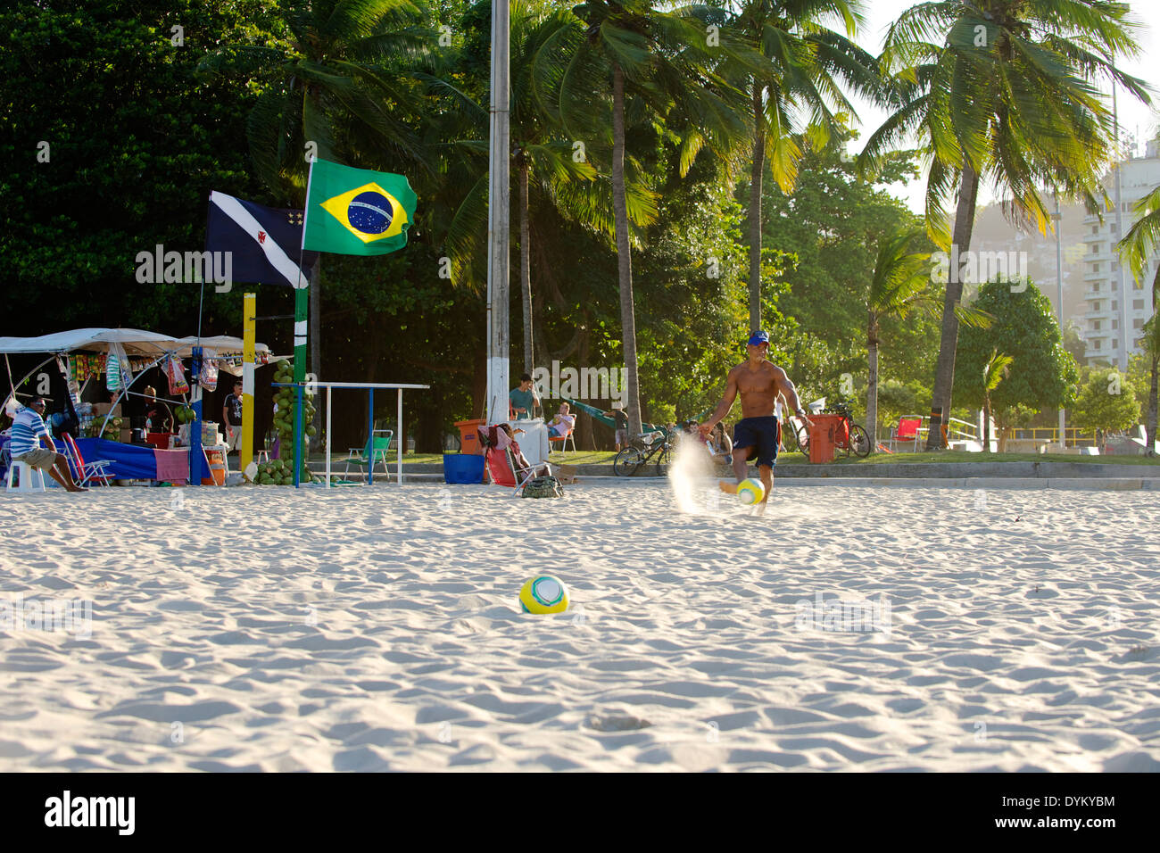Locals Playing Football on Flamengo Beach- Rio De Janeiro Brazil 2014 Stock Photo