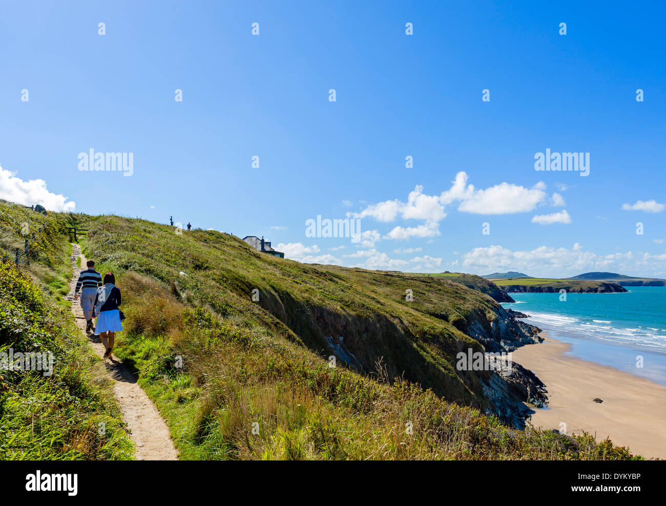 Couple on the Pembrokeshire Coast Path at Whitesands Beach near St David's, Pembrokeshire, Wales, UK Stock Photo