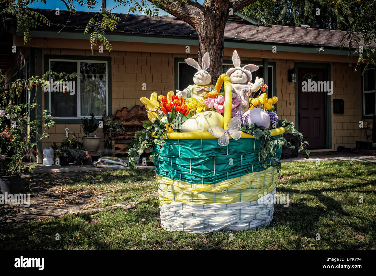 A large Easter basket sits on a lawn outside a home in Burbank