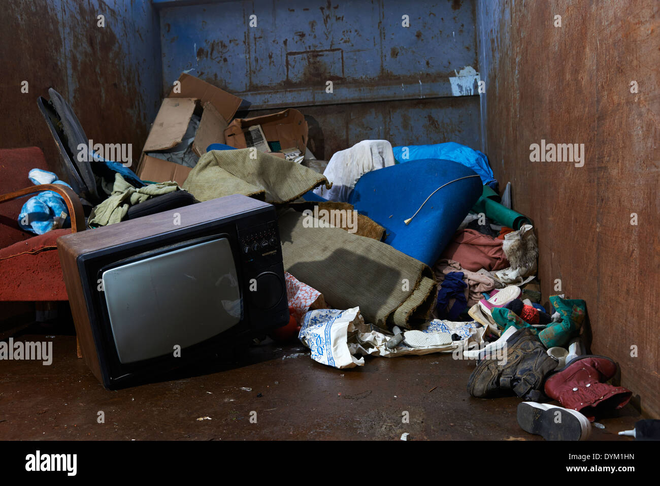 Retro old vintage tv television with pile of rubbish in garbage
