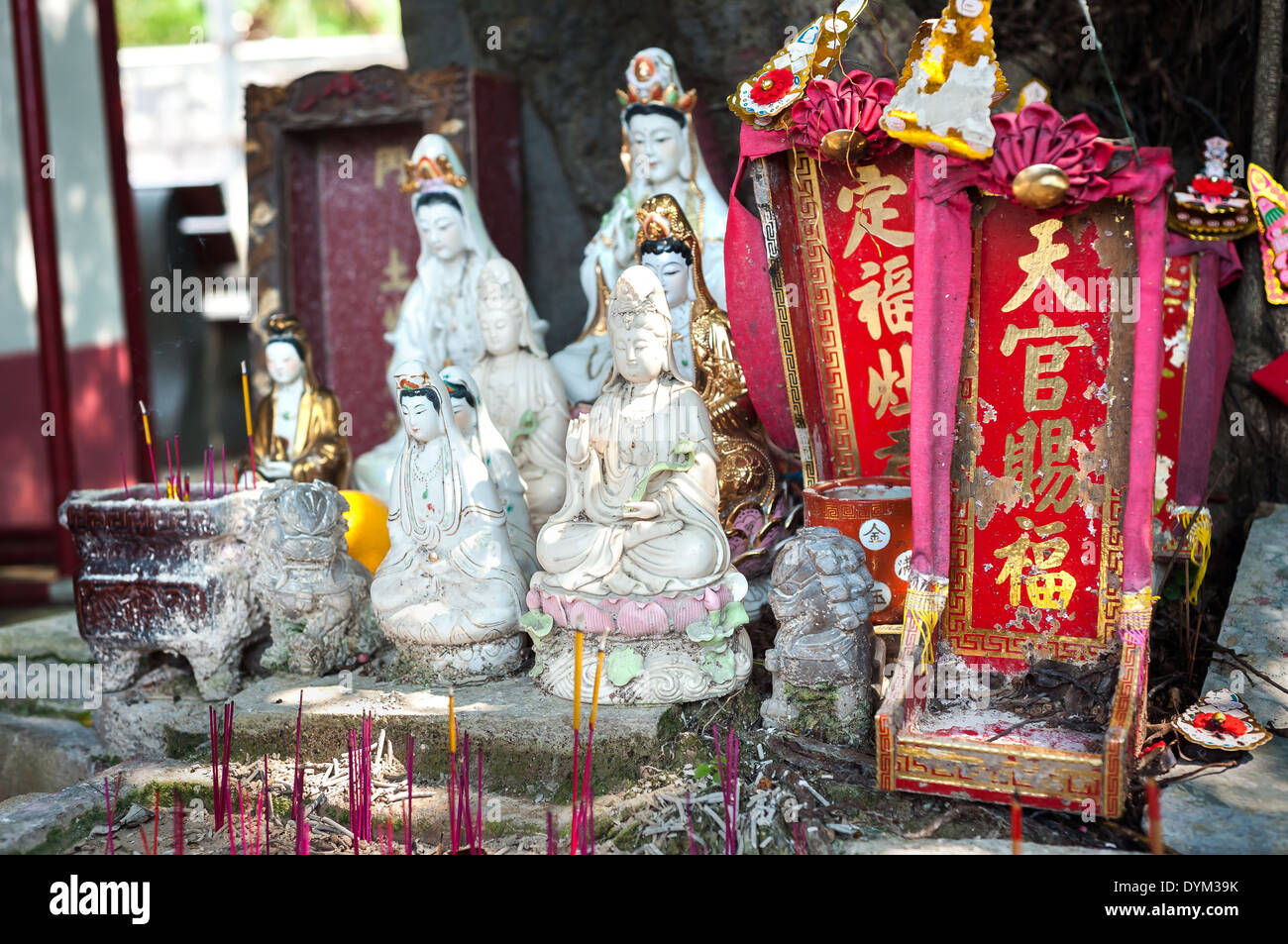Street shrine for Guanyin, the Goddess of Mercy in Hong Kong Stock Photo