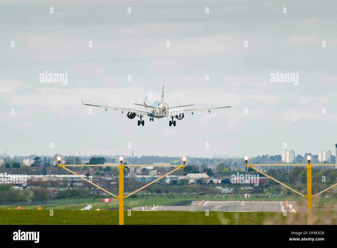 Rear view of a Flybe low cost airlines aircraft performing a cross wind landing at Birmingham International Airport Stock Photo