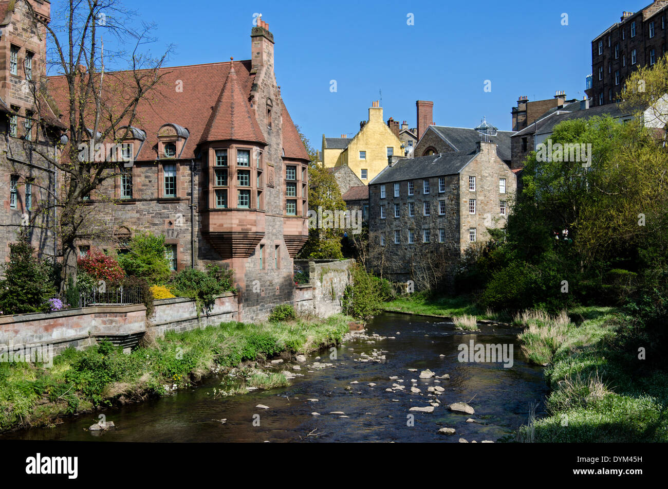 The Water of Leith flowing by Well Court in the Dean Village, Edinburgh. Stock Photo