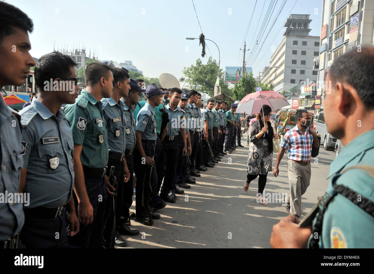 Dhaka, Bangladesh. 22nd Apr, 2014. Policemen stand guard on a street during a long march in Dhaka, Bangladesh, April 22, 2014. Demanding equitable share of common Teesta river water from India, Bangladesh Nationalist Party (BNP) started its two-day road march towards a barrage on Teesta river in an area bordering Lalmonirhat district, some 343 km northwest of Dhaka. Credit:  Shariful Islam/Xinhua/Alamy Live News Stock Photo