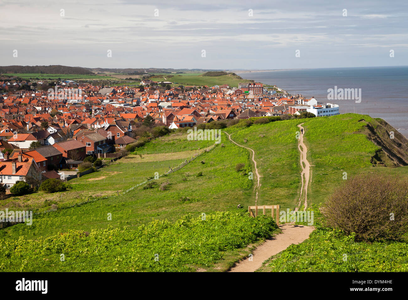 One of Sheringham's clifftop footpaths, with distant view of town's golf course and neighbouring Weybourne Stock Photo