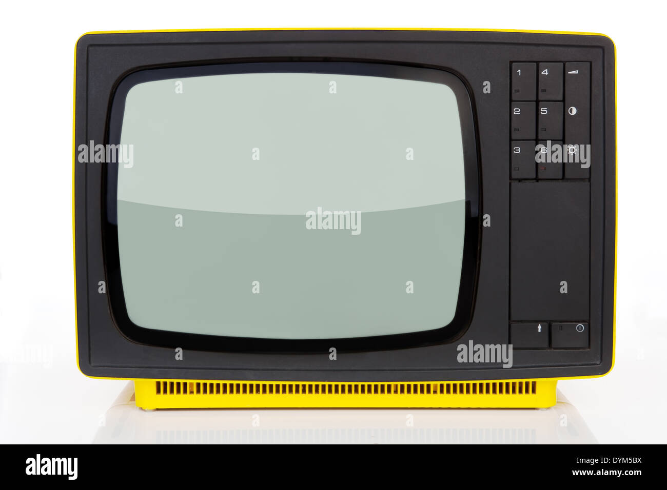 Old yellow retro styled television from 1970's isolated on white background. Retro concept. Stock Photo