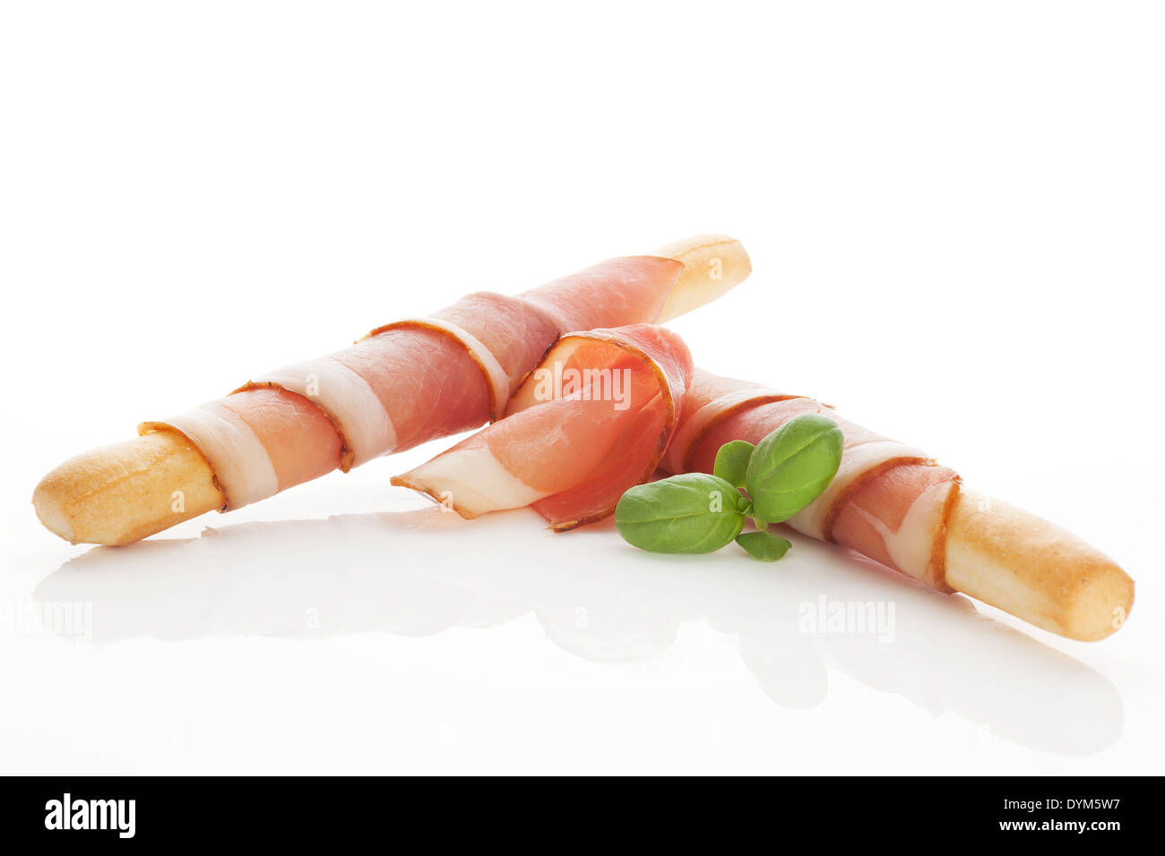 Culinary gourmet starter. Grissini bread wrapped in prosciutto ham. Eating Stock Photo Alamy