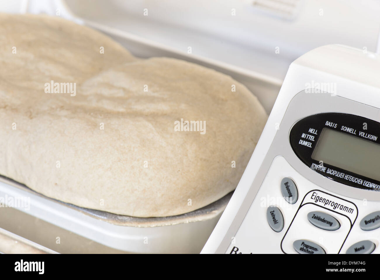 Bread making machine with rising dough Stock Photo