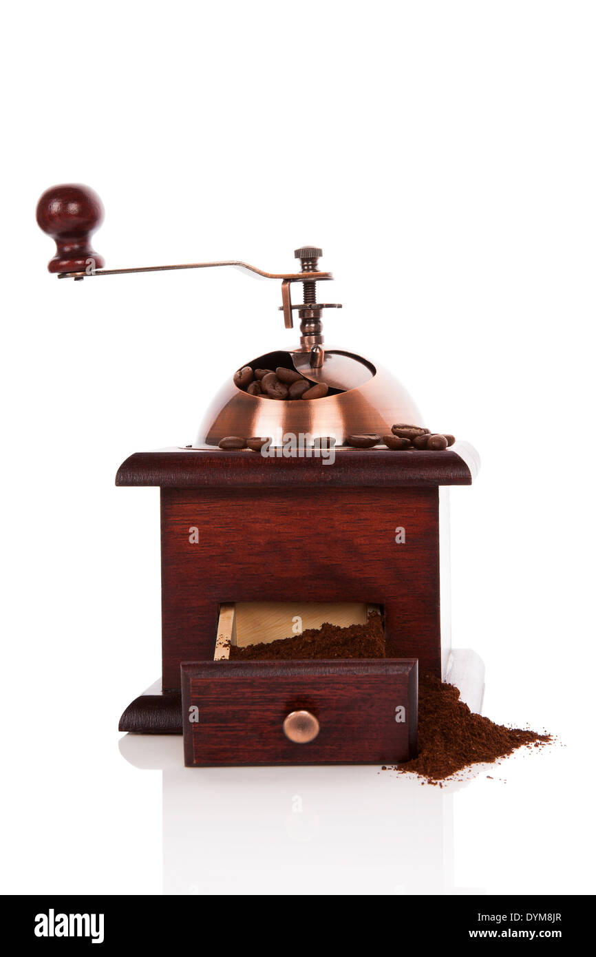 Luxurious wooden coffee mill with coffee beans and ground coffee