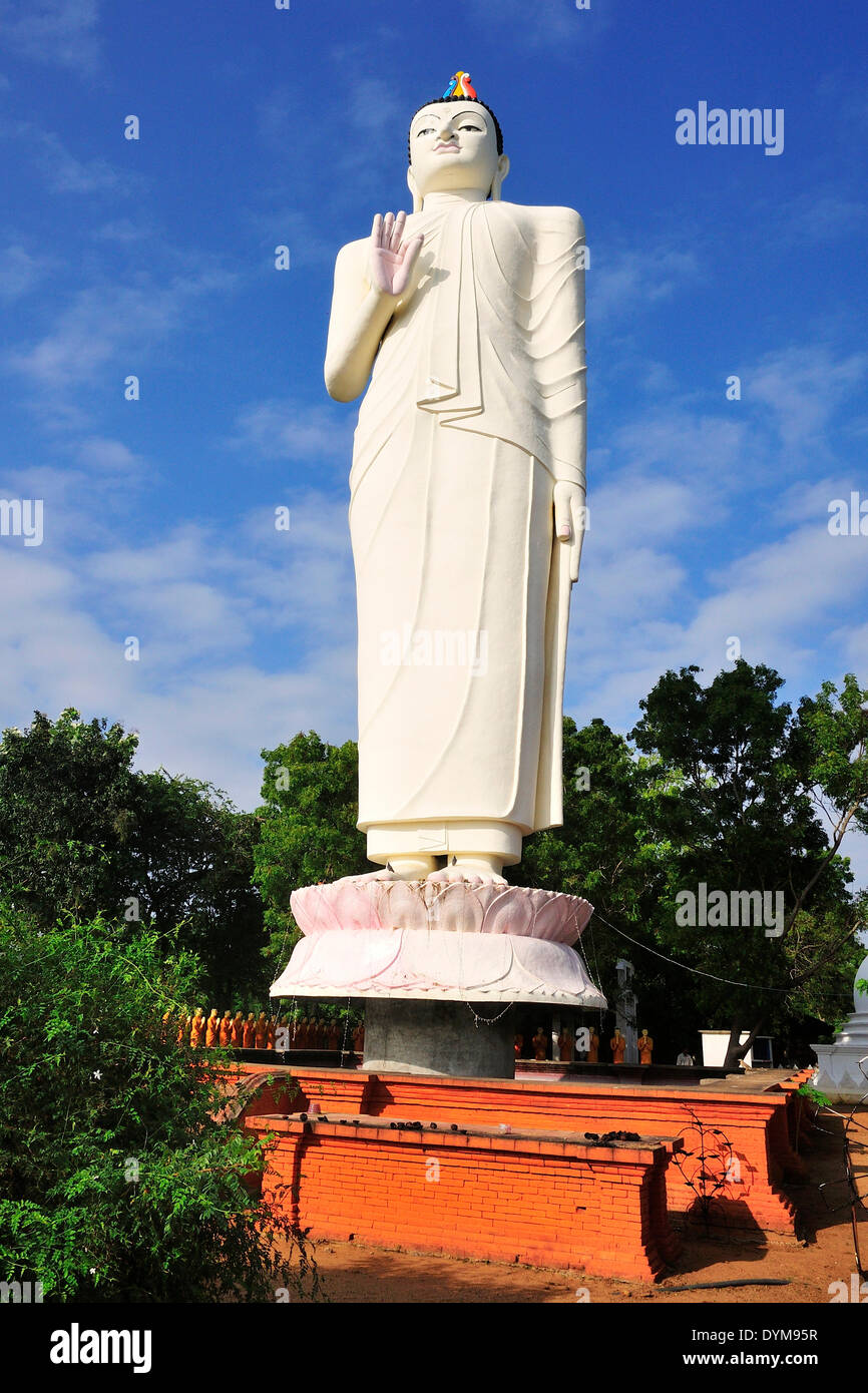Giant Buddha statue in front of a monastery, near Sigiriya, Central