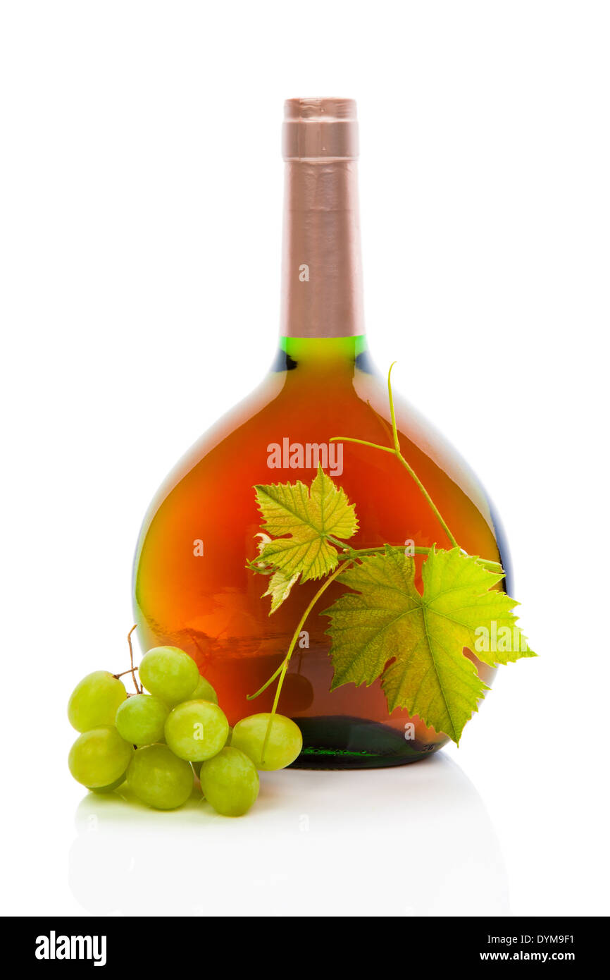 Rose wine bottle without label with wine grapes and grape leaves