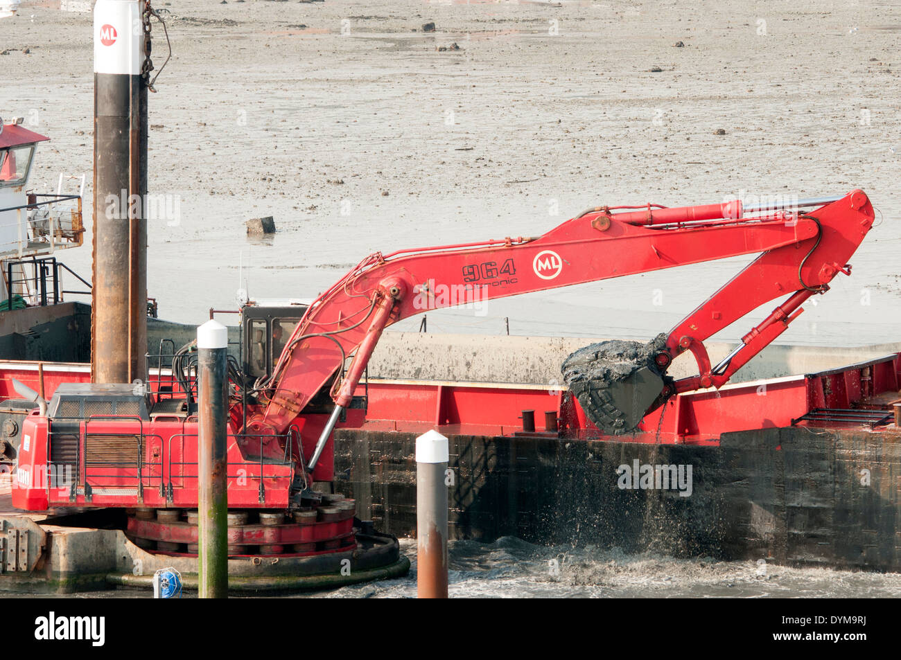 digger dredging a channel Stock Photo