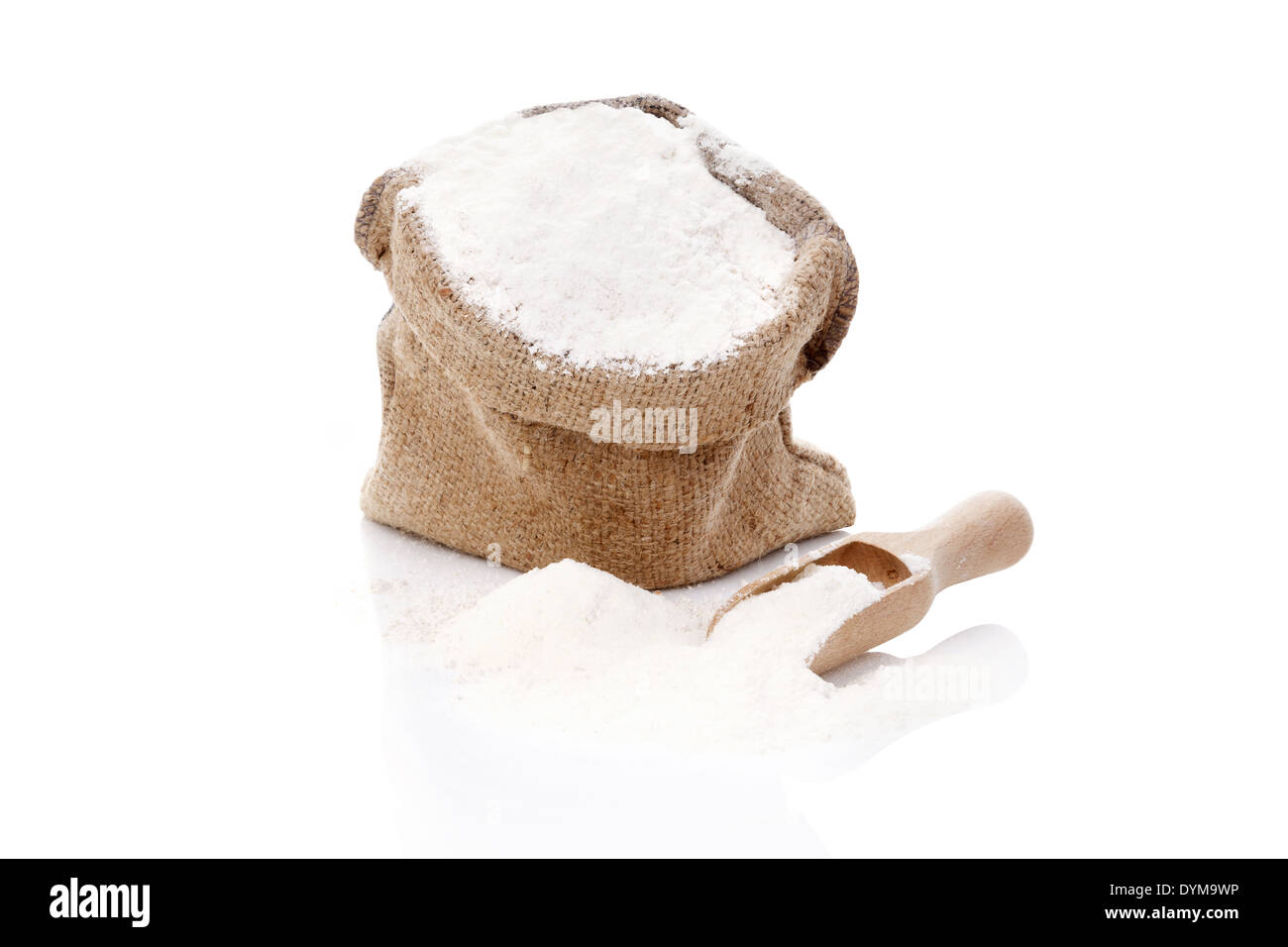 Flour in brown burlap sack isolated on white background. Bread making concept. Stock Photo