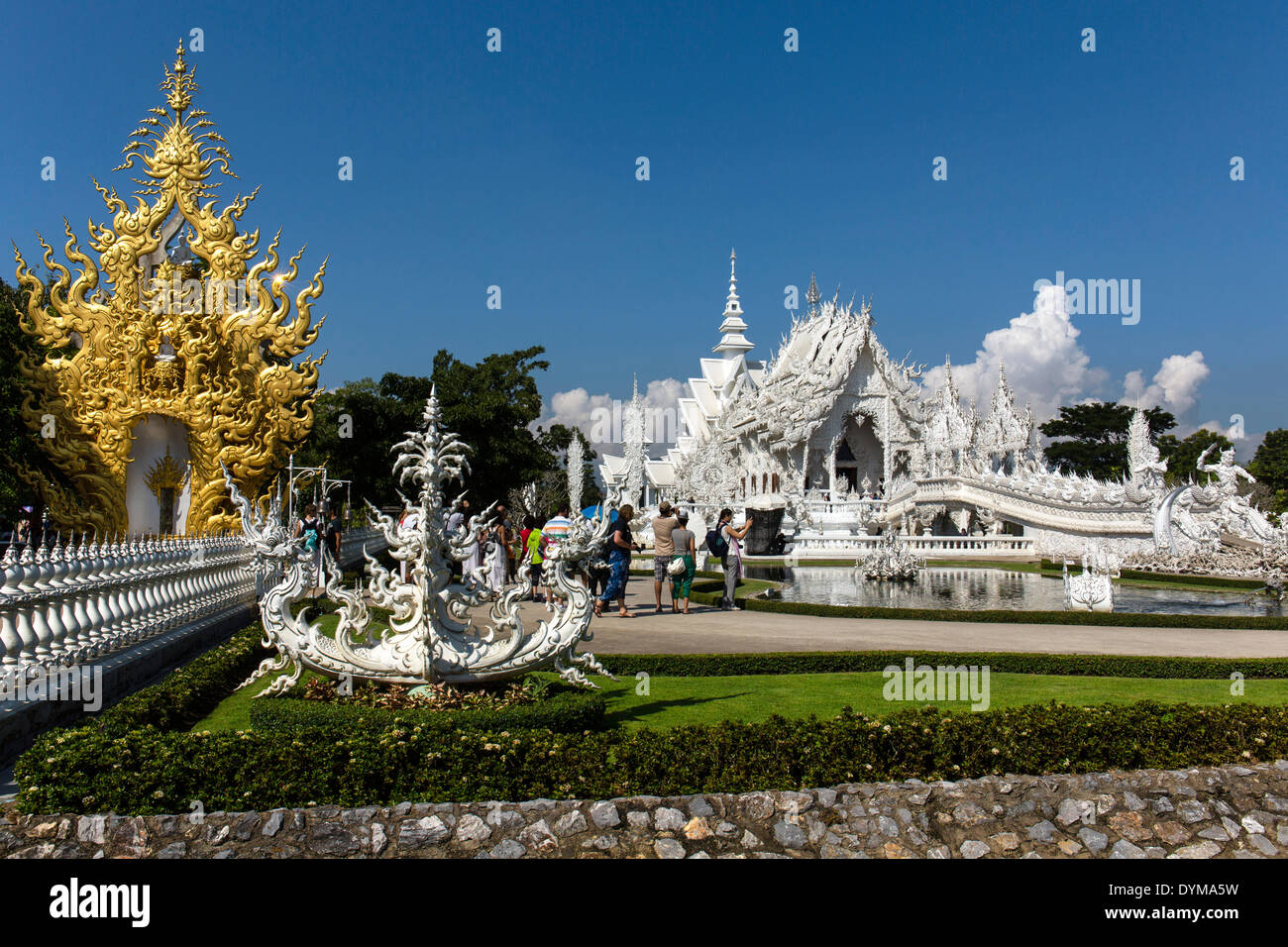 Ornate golend entrance of Wat Rong Khun, White Temple, by architect Chalermchai Kositpipat, Chiang Rai, Chiang Rai Province Stock Photo