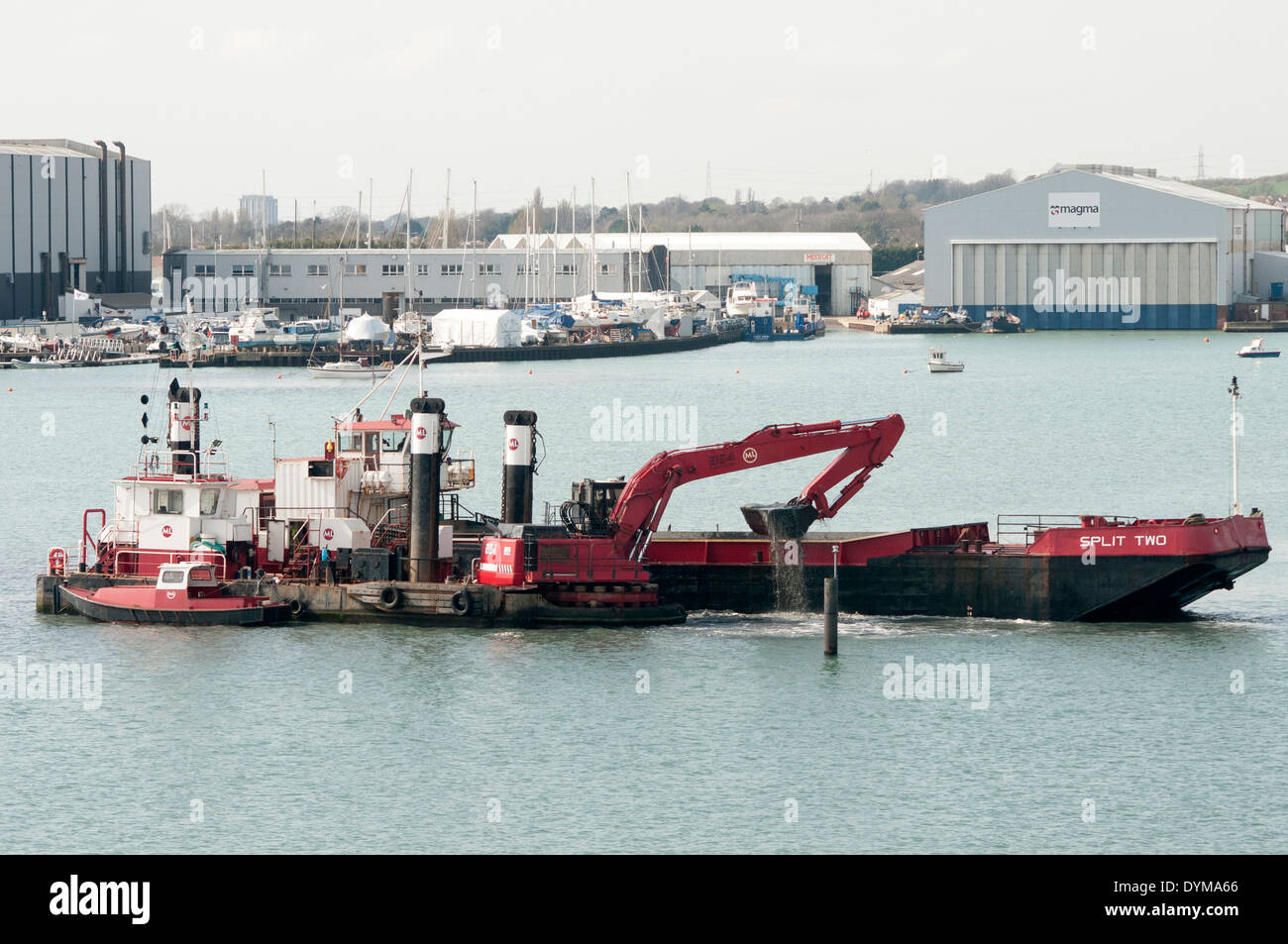 dredger and digger in Portsmouth Harbour Stock Photo