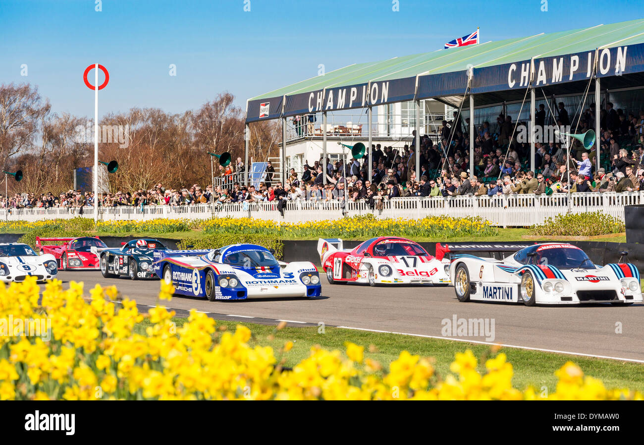 Group C Le Mans cars pass the grandstand on a parade lap at the 72nd Goodwood Members meeting, Sussex, UK. Stock Photo