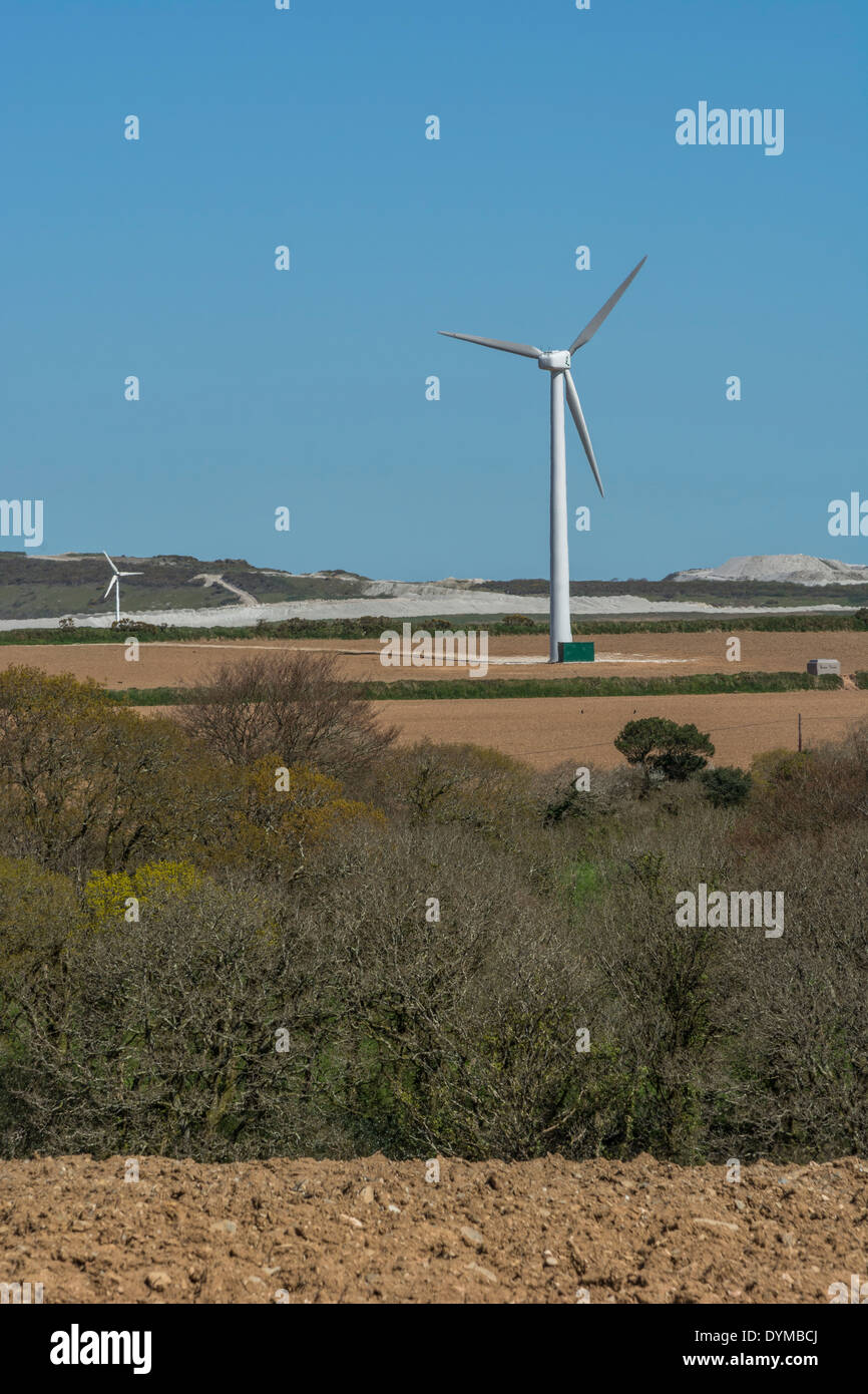 Wind turbine / wind generator in mid-Cornwall field system. 'Wind' is a renewable form of power useful in the climate change energy mix. Stock Photo