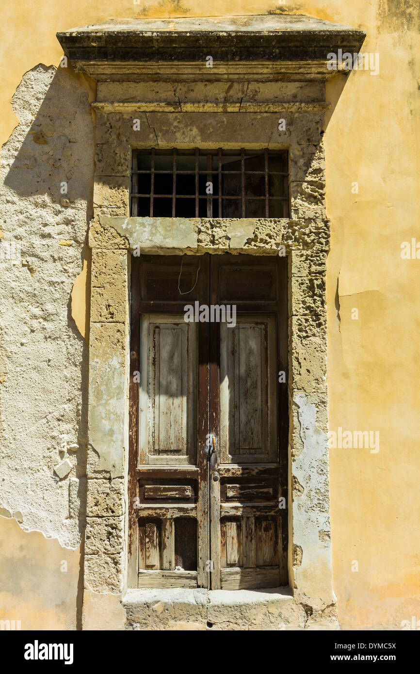 Weathered doorway in this World Heritage city, rebuilt after an earthquake in soft tufa stone
