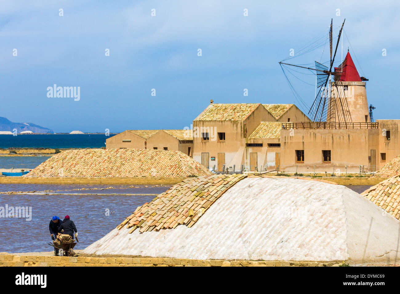 16thC windmill at the Ettore & Infersa Saltworks in the Stagnone Lagoon salt pan area south of Trapani; Marsala, Sicily, Italy Stock Photo