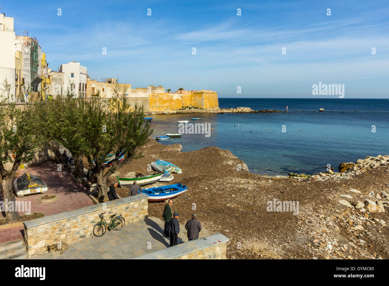 Protected cove & city walls seen from Via Mura Di Tramontana Ovest on sea front of this NW fishing port; Trapani, Sicily, Italy Stock Photo