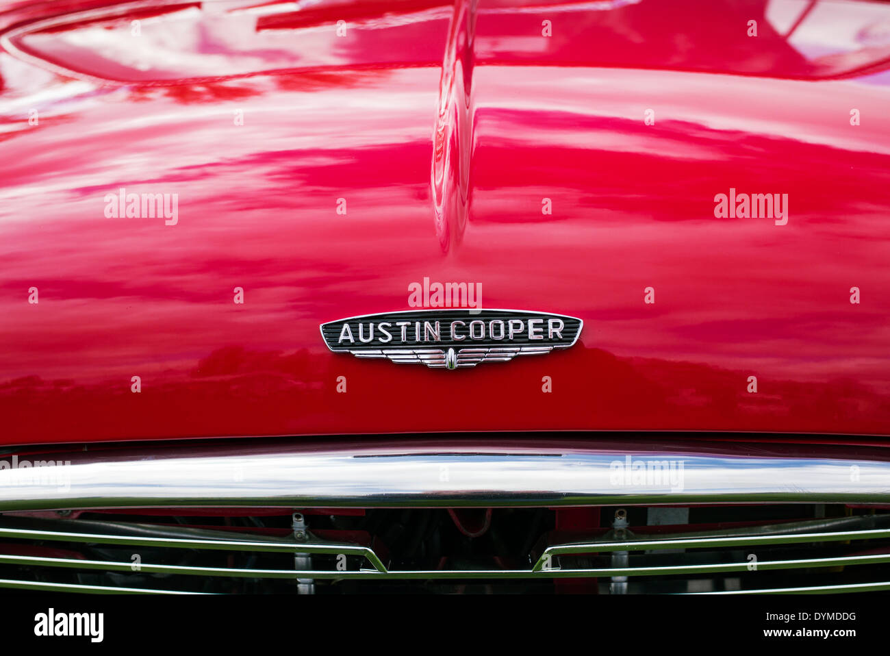 Photo of a Retro Mini Cooper Car Logo Badge on a Red Mini Cooper Car.  Editorial Photo - Image of chrome, motor: 144682971