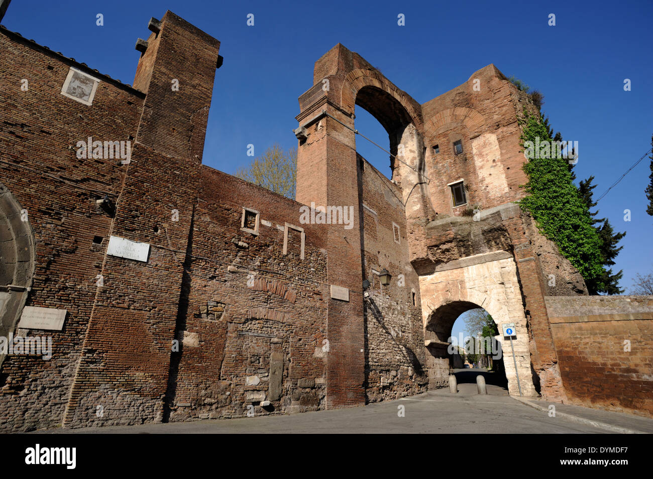 Italy, Rome, Celio, ancient fortifications of the Servian Walls, arch of Dolabella roman gate and Nero aqueduct ruins Stock Photo