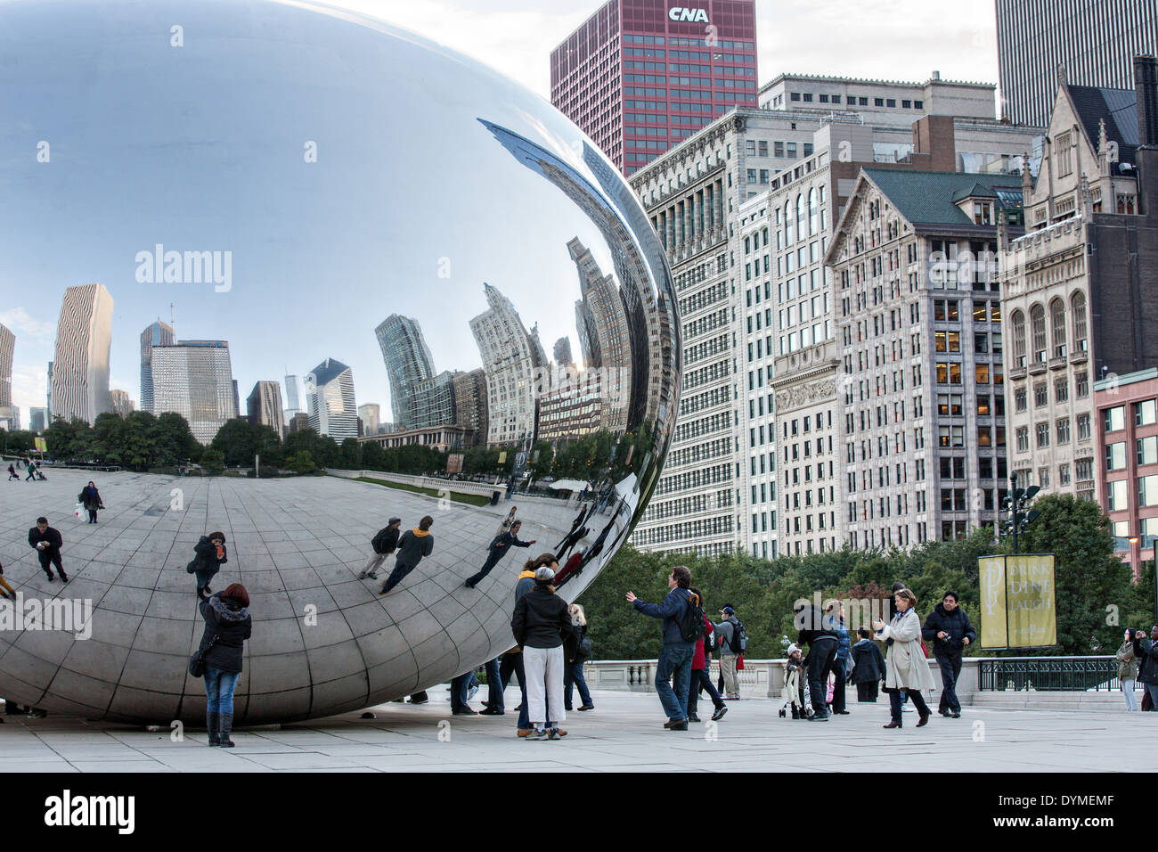 Cloud Gate Sculpture or The Bean with downtown skyline reflected in ...