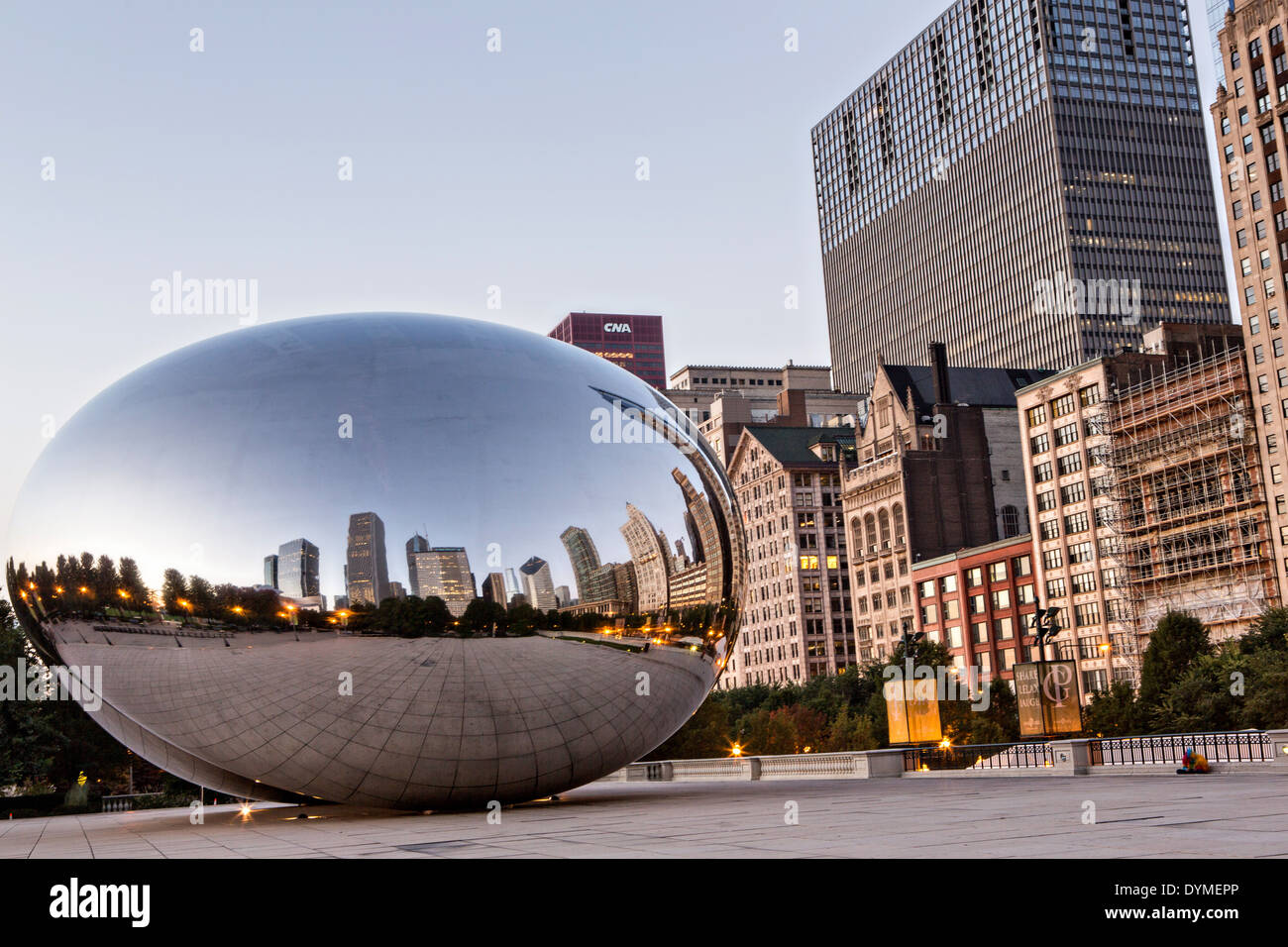 Cloud Gate Sculpture or The Bean with downtown skyline reflected in ...
