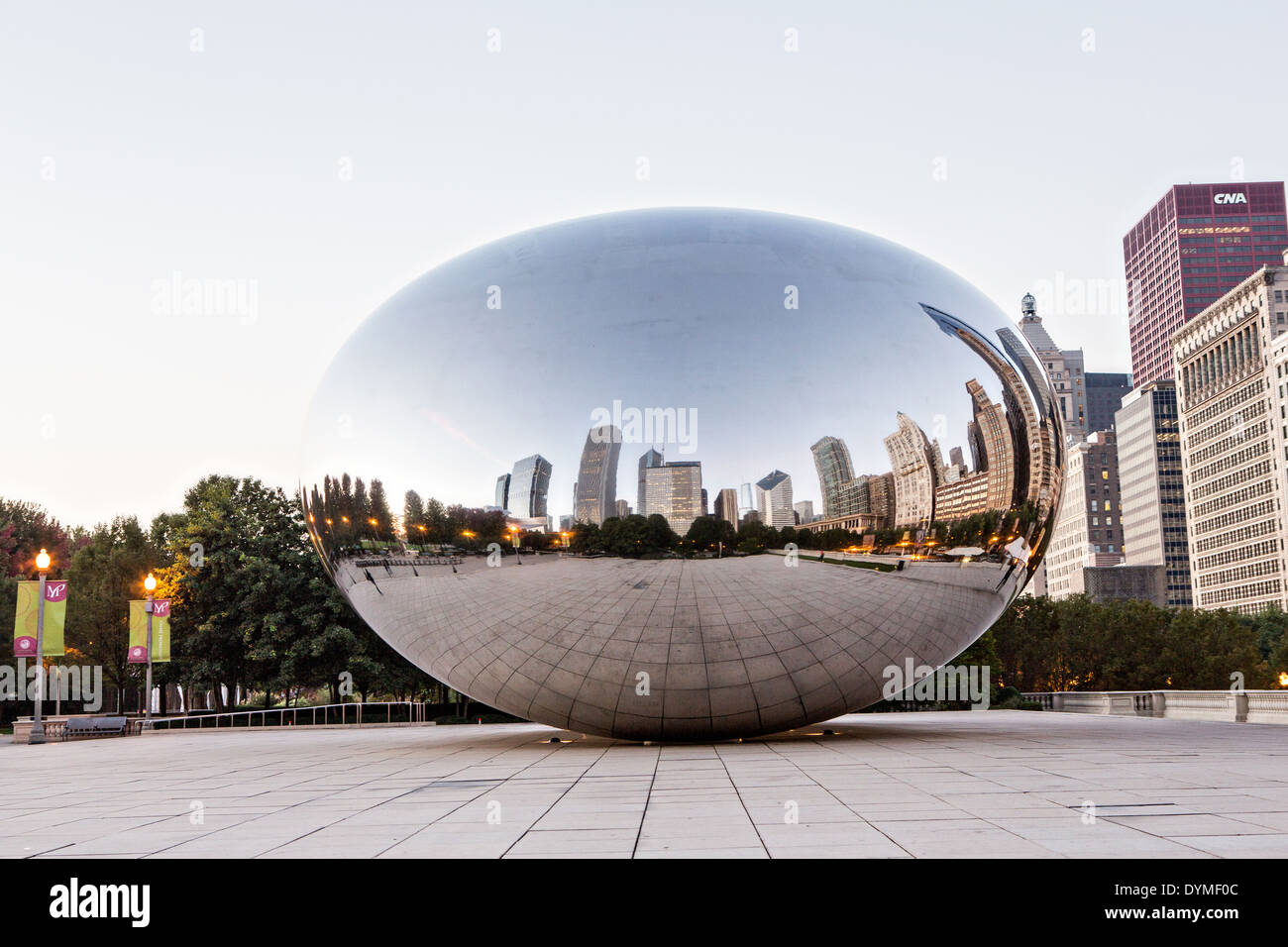 Cloud Gate Sculpture or The Bean with downtown skyline reflected in ...